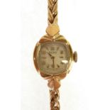 LADY'S ROTARY 9CT GOLD CASED WRIST WATCH, 15 jewel movement, with cushion shaped silvered Arabic