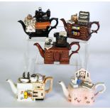 FIVE PAUL CARDEW ONE CUP NOVELTY TEAPOTS, COMPRISING; 'Kitchen sink', 'Lady's Dressing table', '