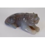 ORIENTAL CARVED BLUE AGATE MODEL OF A TIGER, 3" (7.6cm) long