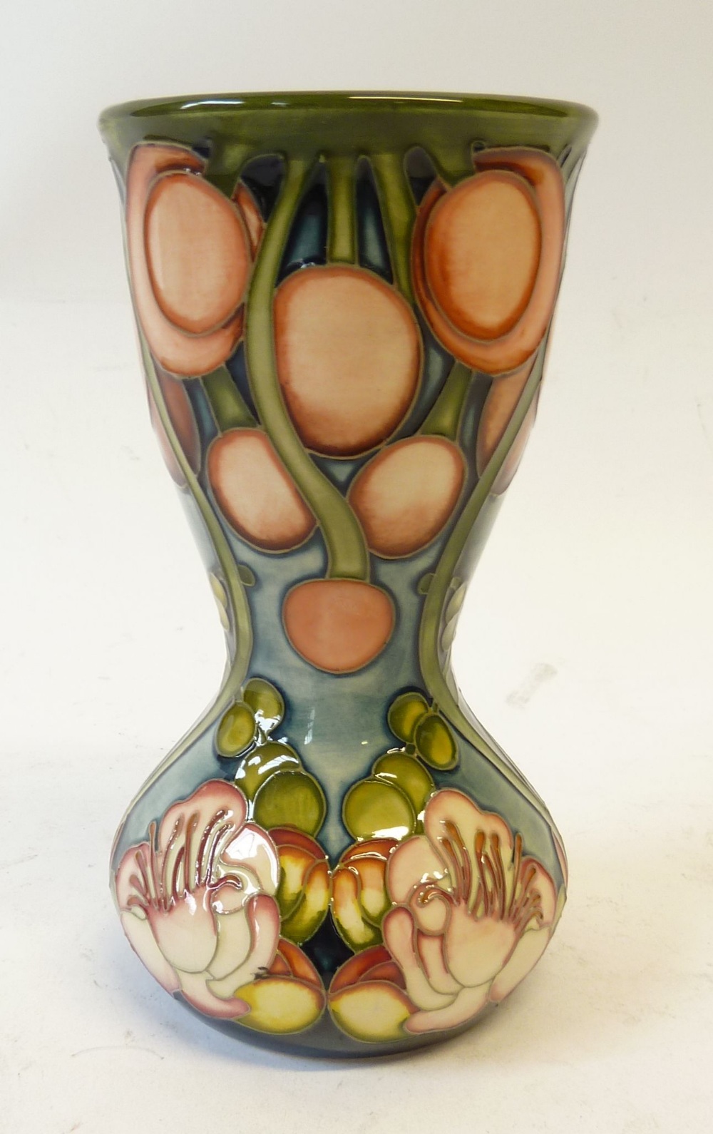 MODERN MOORCROFT CANNONBALL TREE PATTERN TUBE LINED POTTERY VASE, of waisted form, painted in