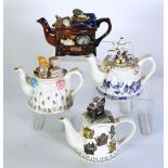 FOUR PAUL CARDEW TWO CUP NOVELTY POTTERY  TEAPOTS, including a Special Collectors edition 'Tea for