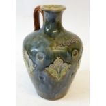 A LATE VICTORIAN DOULTON (LAMBETH) STONEWARE 'SCOTCH' WHISKEY JUG, with loop handle, the dimpled