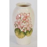 MODERN MOORCROFT TUBE LINED POTTERY VASE, decorated with small pink flowers  and green on an off-