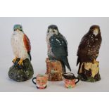 THREE ROYAL DOULTON FOR WHYTE AND MACKAY, BIRD PATTERN POTTERY WHISKY FLASKS, comprising; 'Peregrine