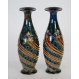PAIR OF ROYAL DOULTON MOULDED POTTERY VASES, of slender, footed ovoid form with waisted necks,