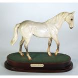 'DESERT ORCHID' ROYAL DOULTON MATT LIGHT GREY CHINA MODEL OF A HORSE, on a wooden plinth with name