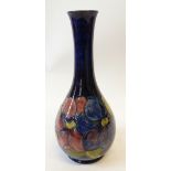 WALTER MOORCROFT 'CLEMATIS' PATTERN TUBE LINED POTTERY VASE,  of footed baluster form with tall