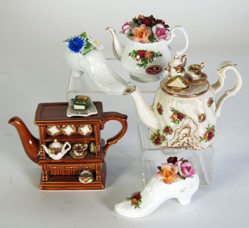 TWO PAUL CARDEW FOUR ROYAL DOULTON ONE CUP NOVELTY TEAPOTS, COMPRISING; 'Welsh Dresser', and 'Old