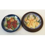 TWO MODERN MOORCROFT TUBE LINED POTTERY COASTERS OR SAUCER DISHES, comprising 'Windrush' in moulded,
