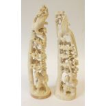 NEAR PAIR OF EARLY TWENTIETH CENTURY CHINESE CARVED IVORY GROUPS, OF HUNTERS KNEELING WITH A MUSKET,