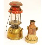 BRASS AND RED PAINTED METAL TILLY LAMP AND A SHIP'S HEAVY BRASS AND COPPER LAMP WITH RING HANDLES (