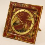 AN EARLY TWENTIETH CENTURY CHINOISERIE RED LACQUERED CASED MANTEL CLOCK, on easel support, the