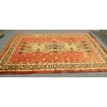 PAKISTANI HAND KNOTTED ALL-WOOL PILE CARPET, with broad pole medallion pattern on a burgundy field