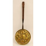 ANTIQUE EMBOSSED BRASS BED WARMING PAN, with turned wood handle, 32" (81.3cm) long