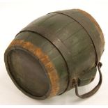 AN OLD METAL BOUND COOPERED WOOD SMALL CIDER BARREL