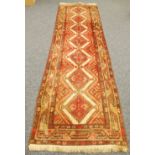 HAMADAN PERSIAN RUNNER, with all-over crimson large diamond shaped medallion pattern on an off white