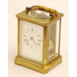 LATE NINETEENTH CENTURY FRENCH BRASS CARRIAGE CLOCK with chiming movement, the white Roman dial