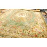 TIENTSIN WASHED CHINESE GREEN GROUND CARPET OF EMBOSSED AUBUSSON DESIGN, with large cream and