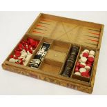 A 19th CENTURY CHESS AND BACKGAMMON COMPENDIUM, the natural and red stained ivory chess set and