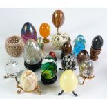 COLLECTION OF THIRTY TWO ORNAMENTAL EGGS, various, including a pierced treen example with screw