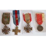TWO FRENCH BRONZE CROIX DE GUERRE 1914-15 AND 1939-40, each with ribbon and star attached, A SIMILAR