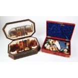 CASED FOUR PIECE TORTOISESHELL BACKED DRESSING TABLE SET, comprising two oval hairbrushes, two