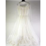 1960s/70s NYLON AND NYLON LACE WEDDING DRESS, empire line with full mesh sleeves, full train and