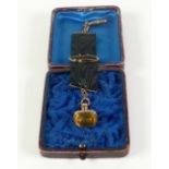 PASTE SET GILT METAL FOB SEAL, ON BLACK MOIRE RIBBON, with mounts, cased (af)