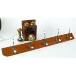 GPO WALL MOUNTED TELEPHONE, mahogany case, with two brass bells, brass dial and brass tulip earpiece