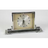 ART DECO 'FOREIGN' CHROME PLATED DESK TOP 8 DAY CLOCK, with tilting oblong Arabic dial and oblong