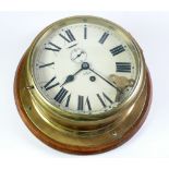 SMITHS BRASS CASED 8 DAY BULKHEAD CLOCK, with 8" Roman Dial with subsidiary seconds dial on an oak