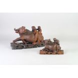 TWO LATE NINETEENTH/TWENTIETH  CENTURY  CHINESE CARVED REDWOOD GROUPS, of children sat on the back