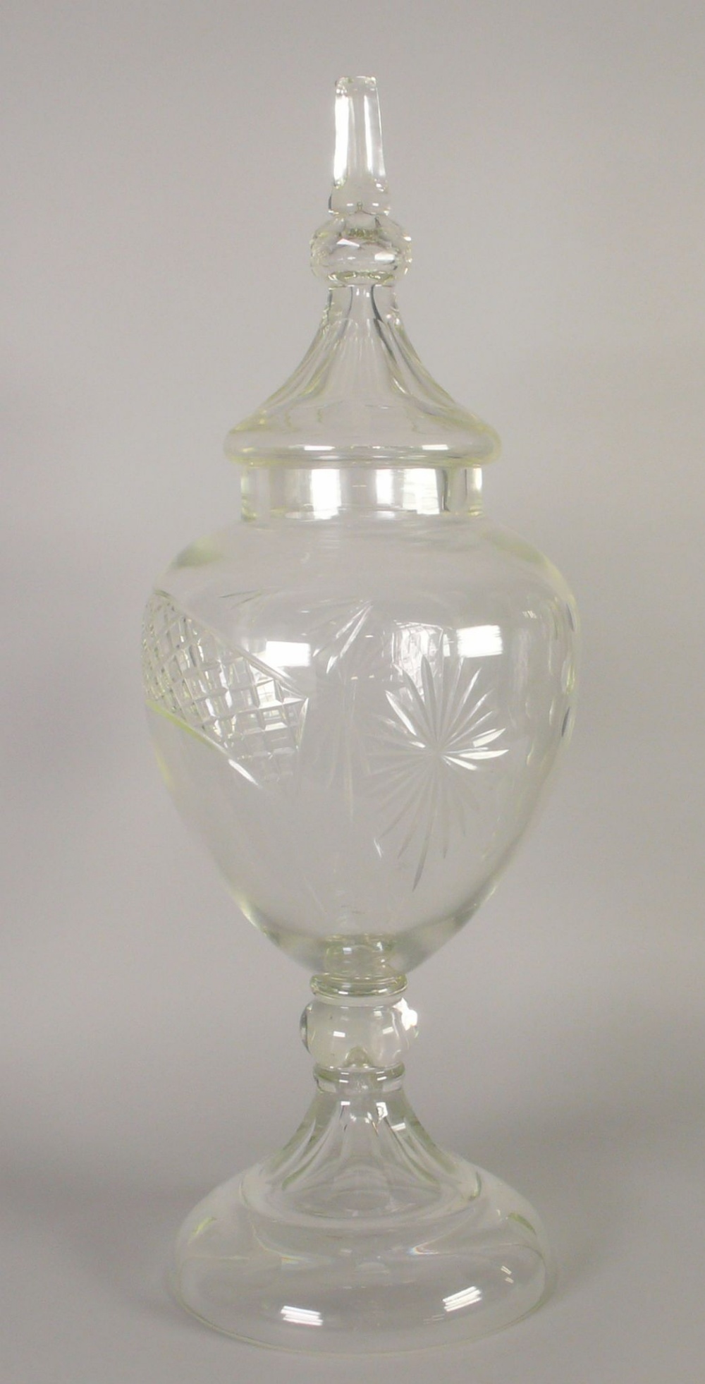 APOTHECARIES LARGE CUT GLASS PEDESTAL JAR AND COVER with cut decoration and spire finial, 31" (78.