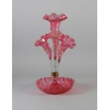 VICTORIAN CRANBERRY GLASS FOUR VASE TABLE EPERGNE, the circular dished base with frilled rim,
