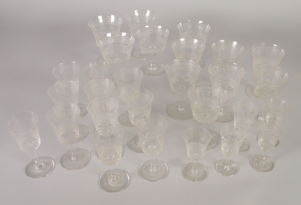 TWENTY EIGHT PIECE PART TABLE SERVICE OF STEMMED DRINKING GLASSES, with wriggle engraved borders,