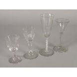 FOUR ANTIQUE GLASSES, including an ALE GLASS with hops and barley engraved to the funnel bowl and