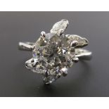 SOLITAIRE DIAMOND RING, round brilliant cut diamond of approx. 1.63ct, VS2-SI1, FLANKED BY FOUR