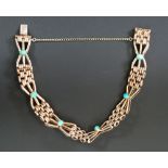 TURQUOISE SET GOLD GATE LINK BRACELET, formed of gate and bow shaped turquoise set links, stamped