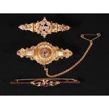 VICTORIAN GOLD ETRUSCAN STYLE BROOCH, with paste set cluster centre, with glazed locket back,