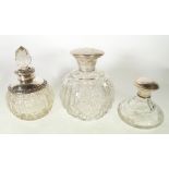 CUT GLASS SQUAT SHAPED CIRCULAR PERFUME BOTTLE with plain silver screw off lid, 2 3/4" high,