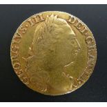 A GEORGE III GOLD GUINEA 1776, fourth head (vf)