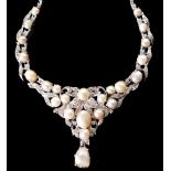 PEARL AND DIAMOND NECKLETE, the drop shaped front set with 23 varisized pearls and a baroque pendant