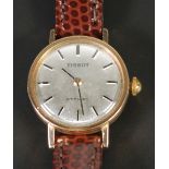 LADY'S TISSOT STYLIST 9CT GOLD CASED WRIST WATCH, 17 jewel movement, silvered dial with batons, on