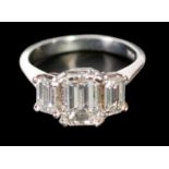 THREE STONE EMERALD CUT DIAMOND RING, principle diamond 1.50ct, G, SI1, with flanking emerald cut
