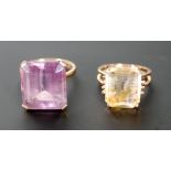 AMETHYST SET RING, the large cushion cut amethyst in four claw setting to the plain stamped 9ct gold