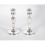 PAIR OF SILVER WEIGHTED CANDLESTICKS, octagonal stems on domed circular bases, 6" (15.2cm) high,