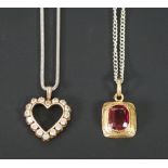 SYNTHETIC RUBY PENDANT, cushion cut ruby in rub-over setting in foliate engraved rectangular gold