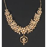 NINETEENTH CENTURY LARGE ORNATE NATURAL SPLIT SEED PEARL SET GOLD NECKLACE, the front with graduated