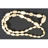 EARLY TWENTIETH CENTURY GRADUATED IVORY BEAD NECKLACE, formed of 47 graduated oval and round ivory