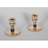 PAIR OF SILVER SHORT CANDLE HOLDERS with campana shaped sconces on circular bases, 3" high,